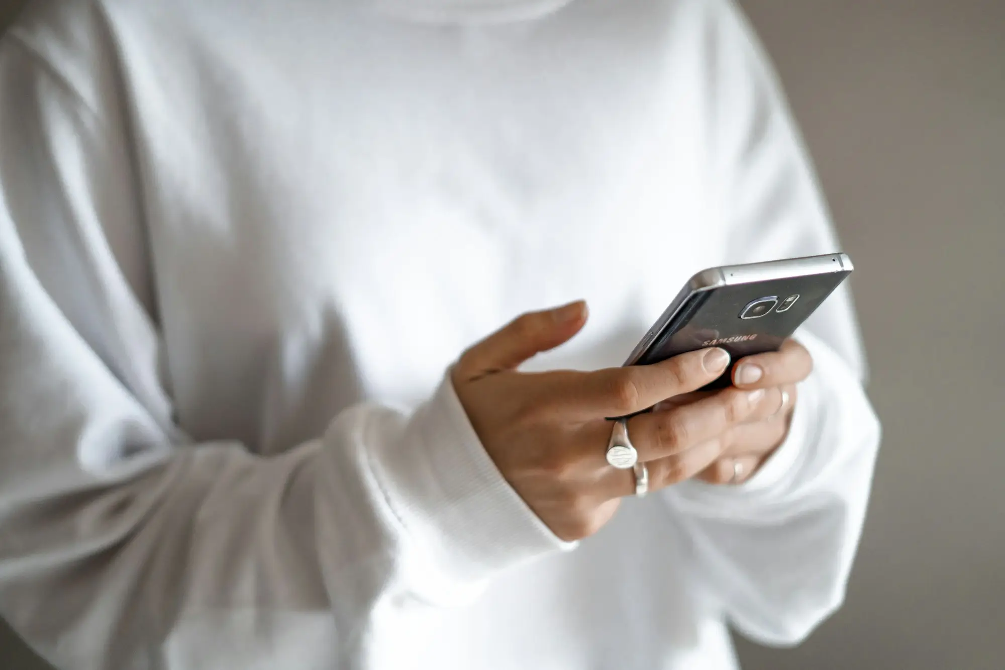 Person checking a message on a smartphone